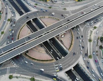 An aerial view of a crowded highway interchange illustrates the complexity of fundraising operations.