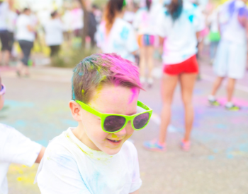 Kids with dyed hair at a fun run show the range of activities available to peer to peer fundraisers in 2025.