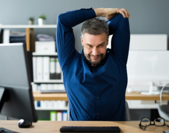 A stretching worker illustrates the challenges of donor expectations in 2025.