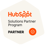 HubSpot Solutions Partner Program badge showing the HubSpot logo, the words Solutions Partner Program, Partner in bold, and an orange checkmark icon inside a circle.