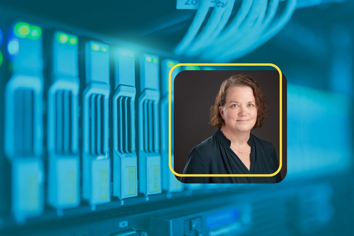 A close-up of server racks with glowing lights, overlaid with a bordered portrait of Venta Cantwell, Raisers Edge consultant, who recently joined Heller Consulting—she has short curly brown hair, a dark blouse, a necklace, and a slight smile.