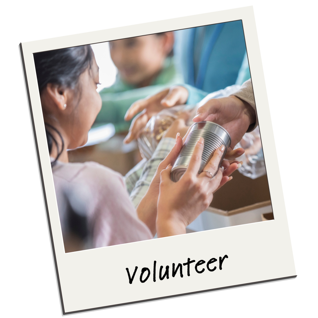 A woman smiles as she hands a canned food item to another person at a volunteer event, supported by Heller Consulting Donor Data Hub for nonprofit identity resolution. Children are visible in the background and "volunteer" is written at the bottom.